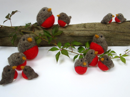 needlefelt robins on a log