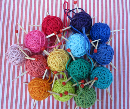 mini balls of yarn with needles