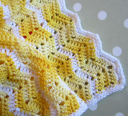 Ripple baby blanket in yellow and white
