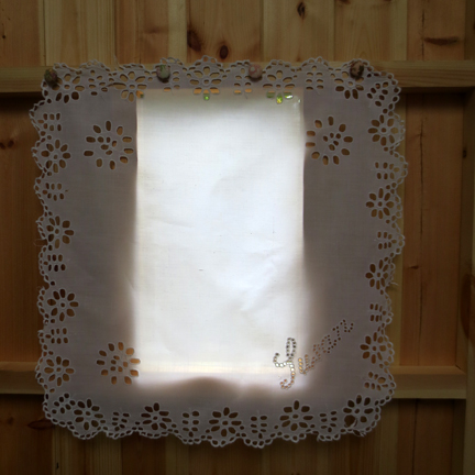 window with cutwork cloth